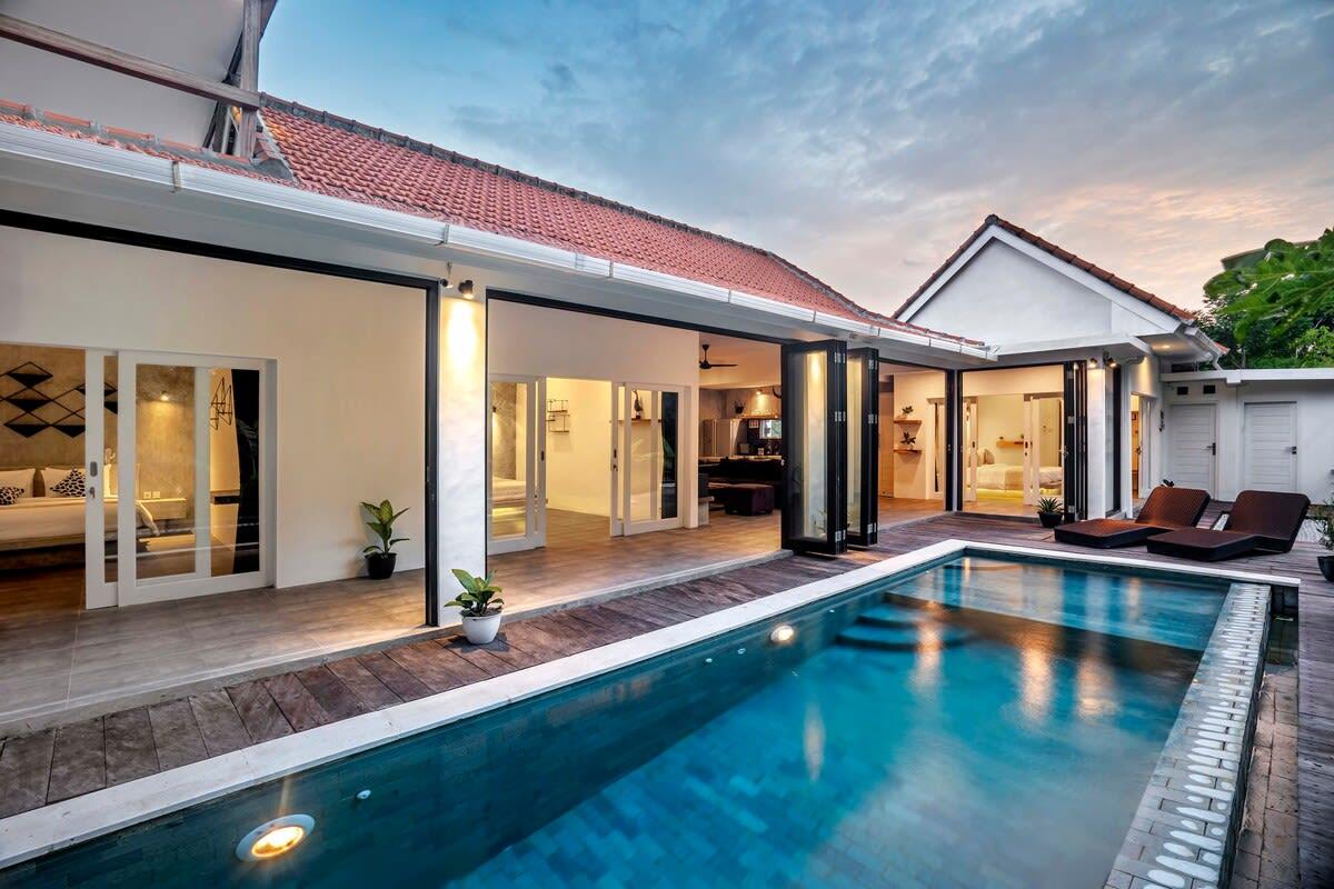 View of the villa and lounging area from the outside pool 