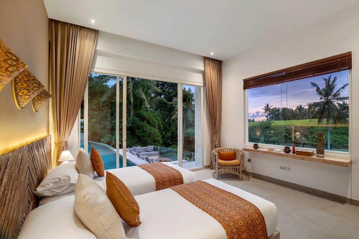 Twin bedroom with a beautiful jungle view 