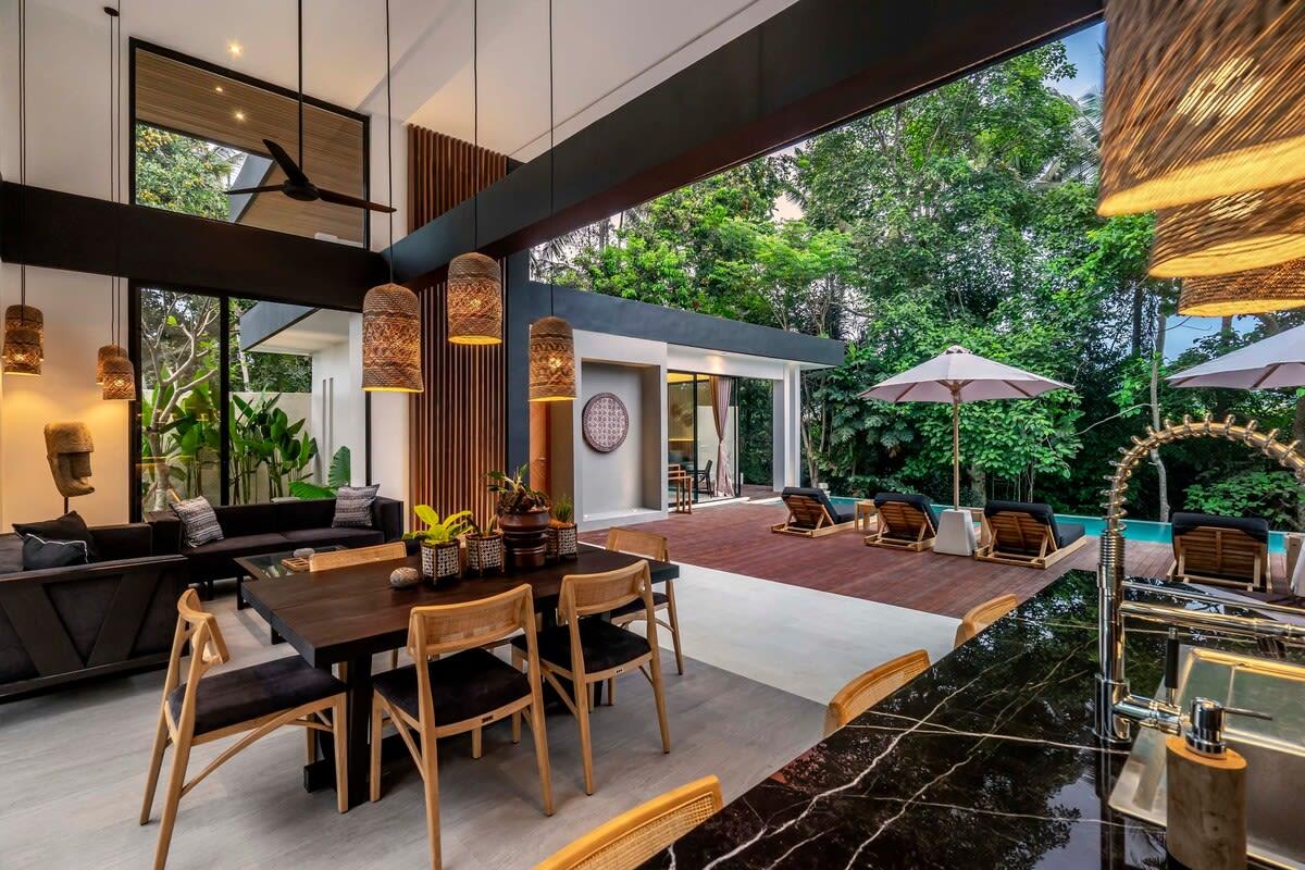 View of the dining area overlooking the terrace and pool 