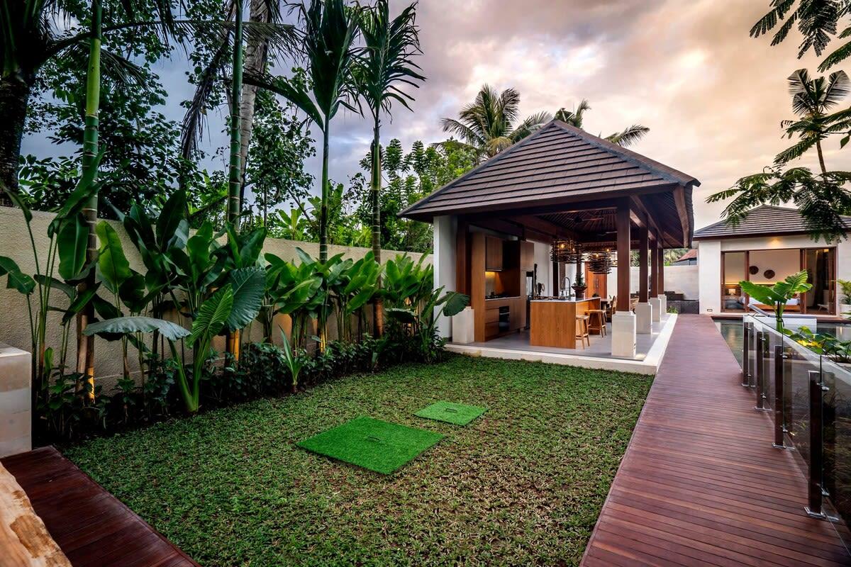 Wooden pathway leading to the secluded sitting area of the villa