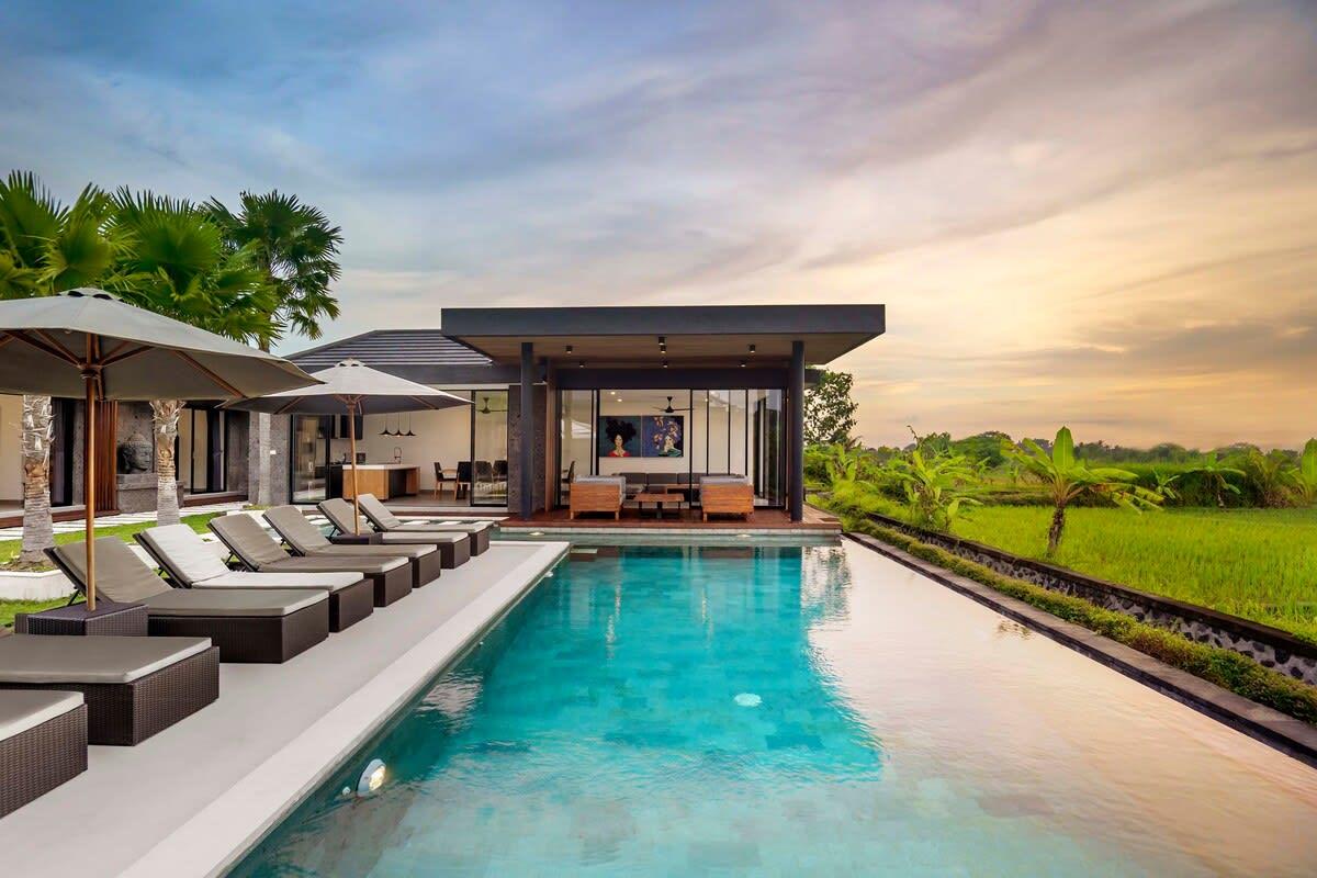 Side view of the pool and lounging area of the villa 