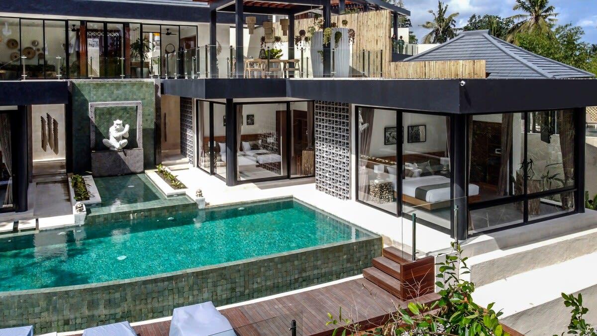 View of the two bedrooms that have a pool and jungle panorama