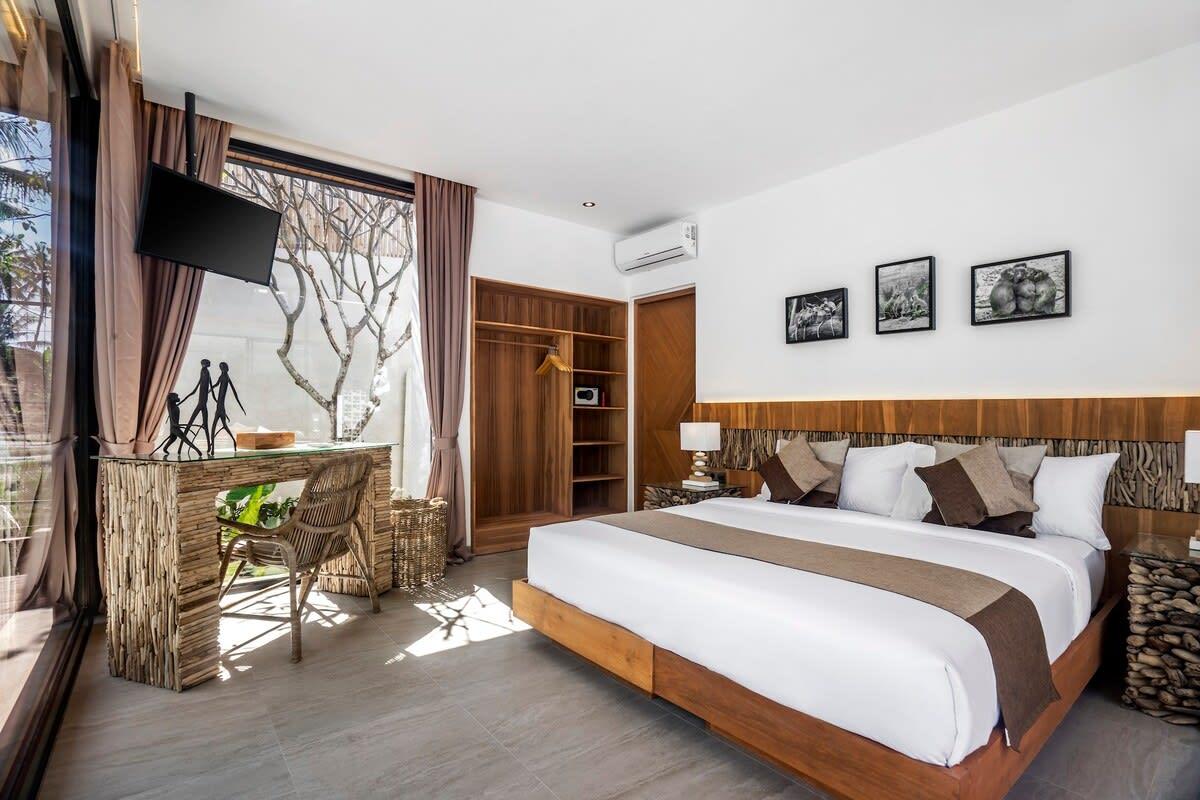 Wooden styled bedroom with natural light coming from the side