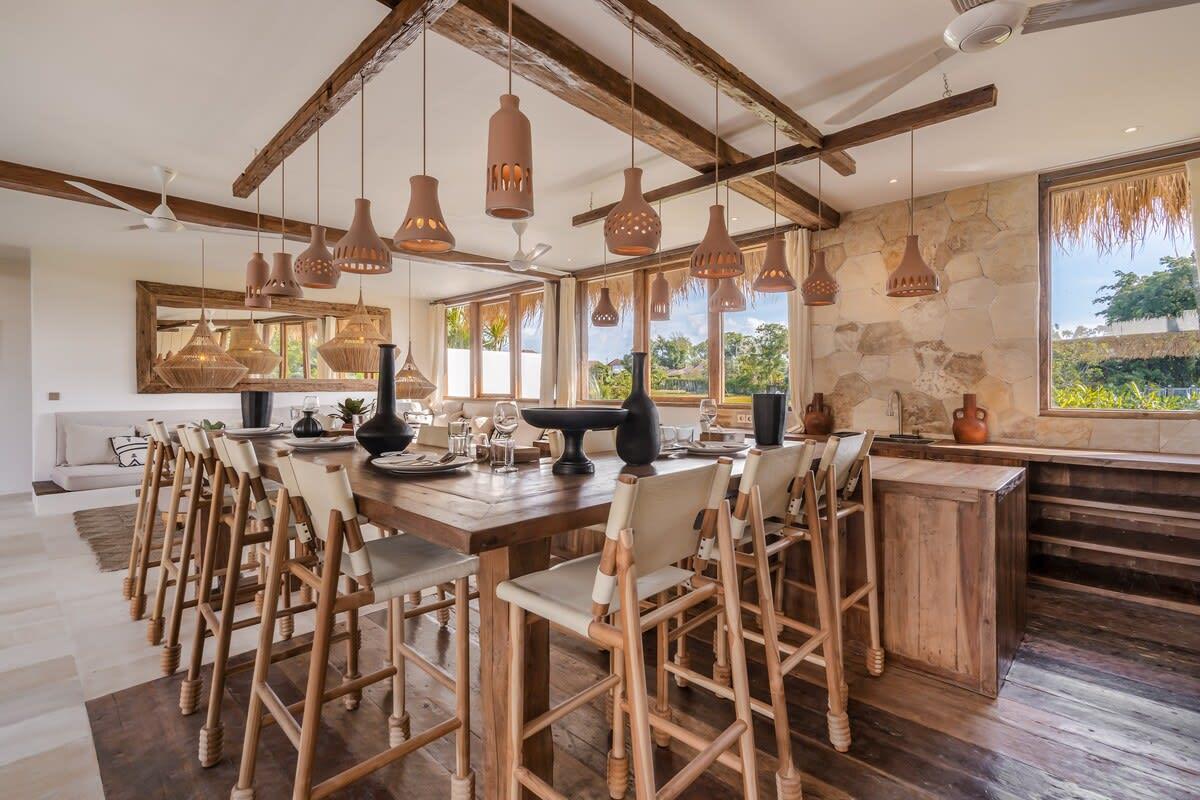 Open kitchen with big bar and 12 chairs. 