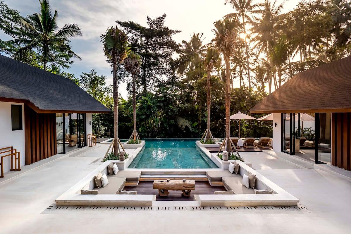 Outdoor sitting area overlooking the turquoise pool