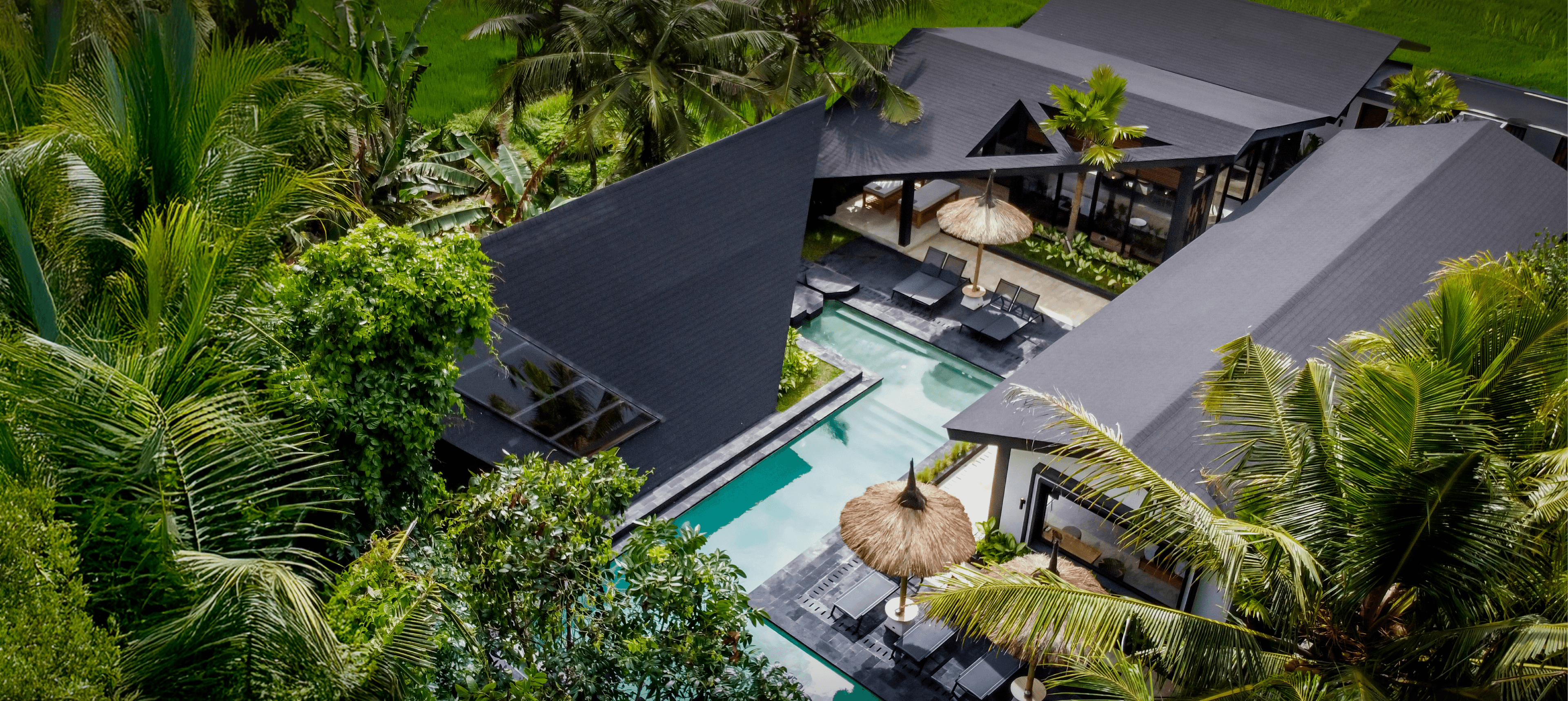 One of our villa, Crazy Roof, from top view, surrounded by lush greeneries and rice paddies.