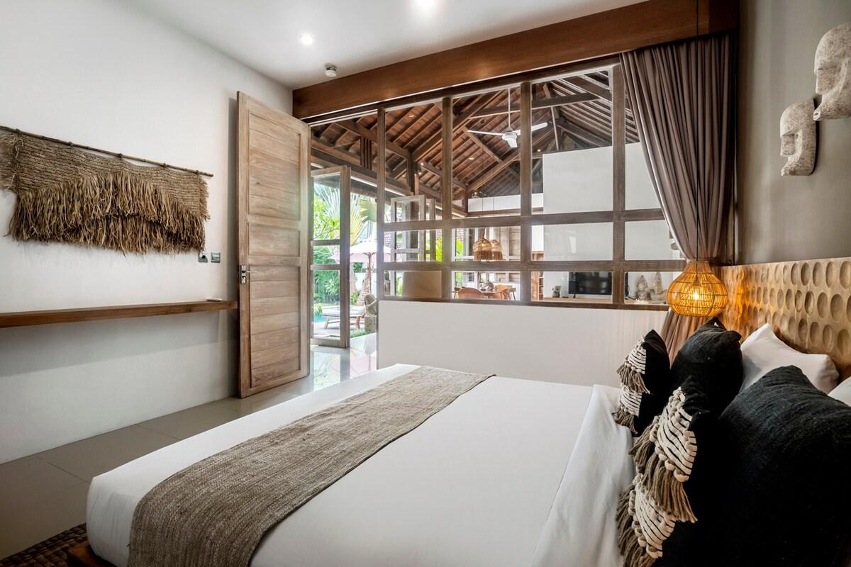 Modern bedroom with a view of the outside dining area 