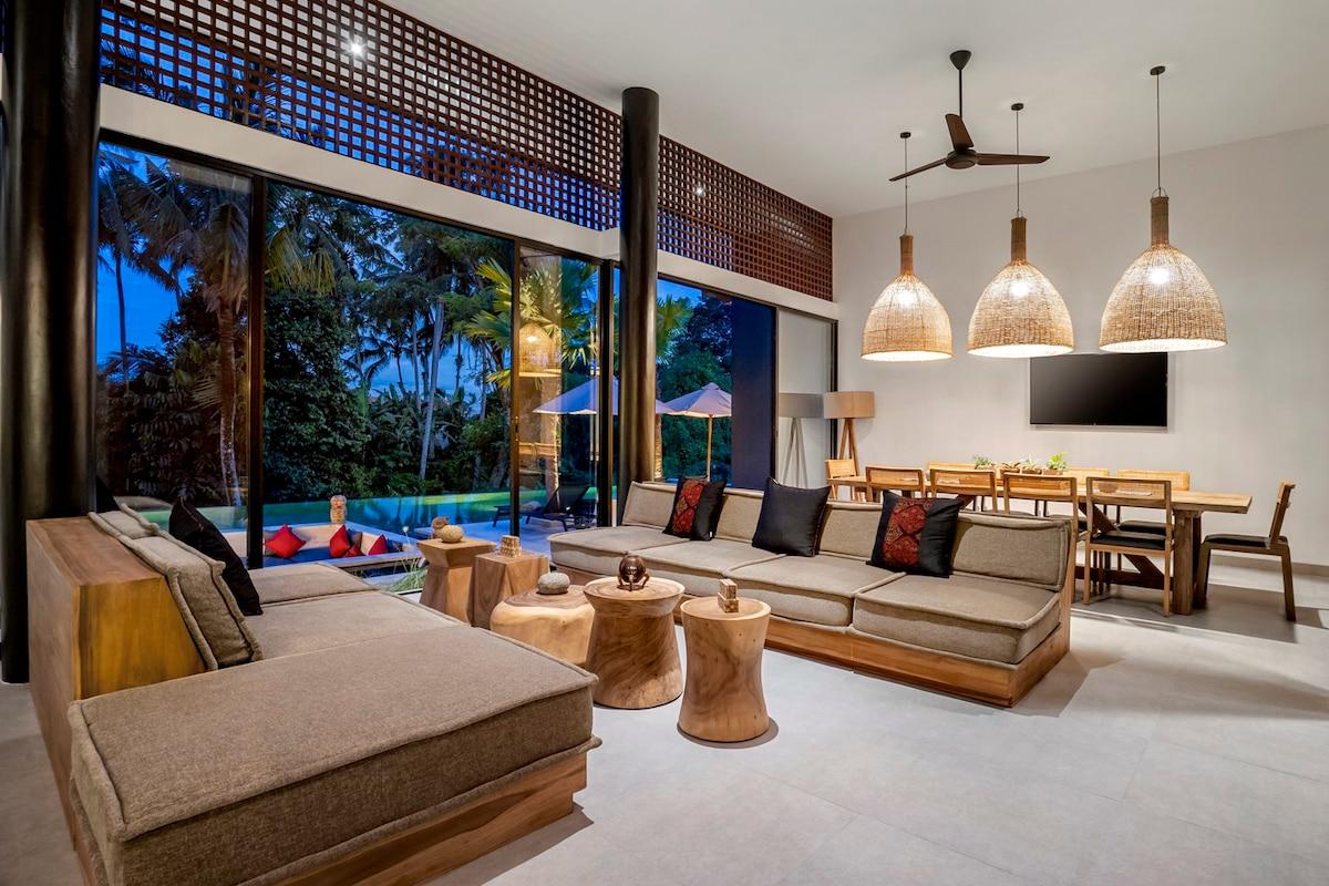 Spacious inside living room with a pool view
