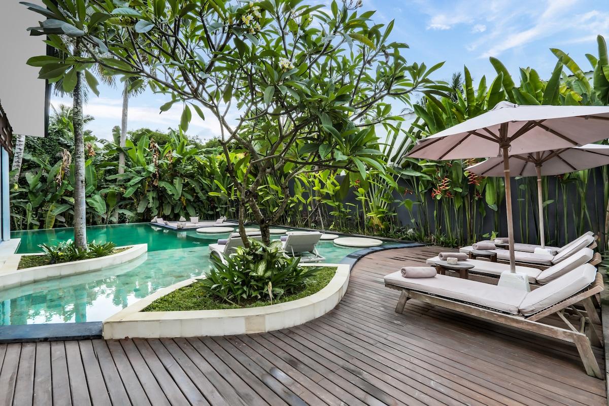 Nature's embrace at the villa: A garden retreat with a poolside view