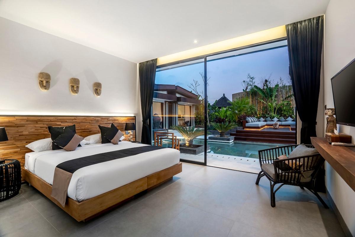 Spacious bedroom with a pool view 