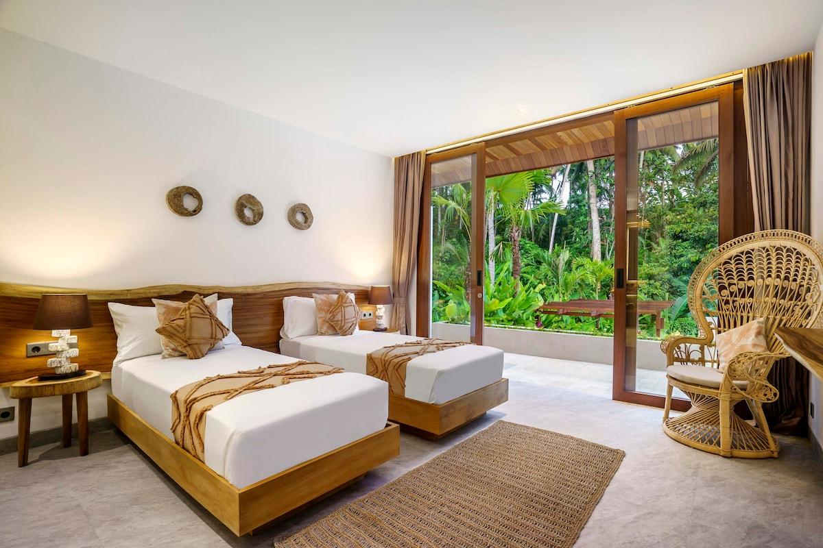Twin bedroom with a beautiful jungle view 